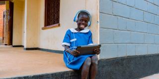 Smiling child with tablet