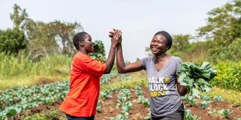 Female farmers high five