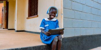 Smiling child with tablet