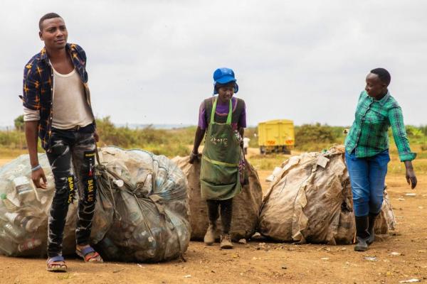 Youth collecting waste