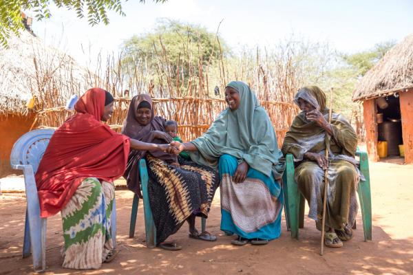 Smiling women from different tribes